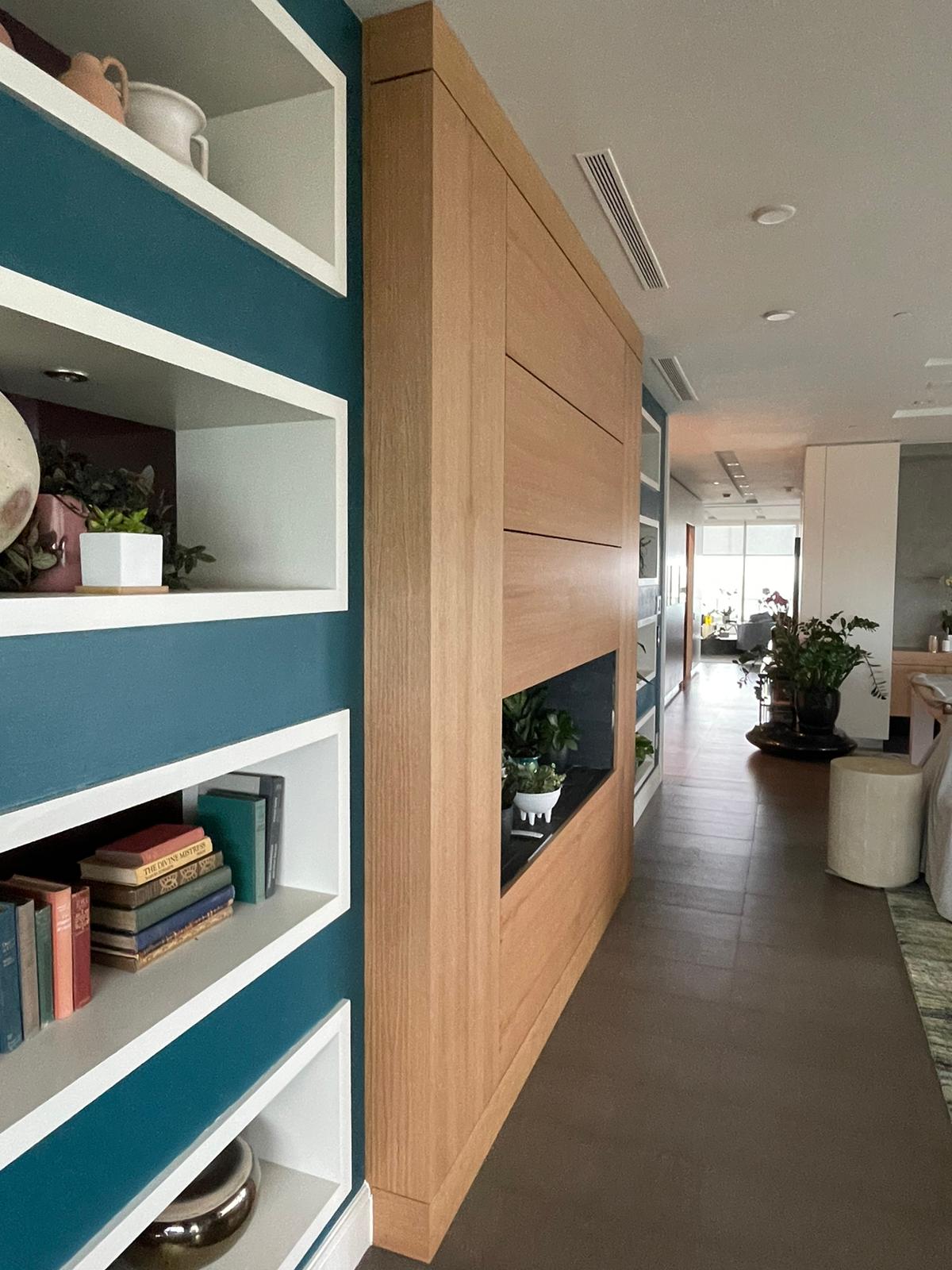 Custom oak partition and built-in display wall completed by Bellstone Property Services